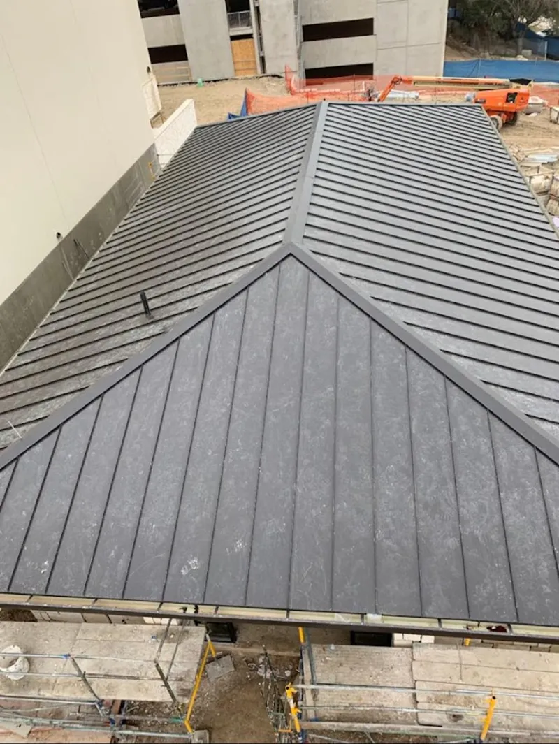 Commercial metal roof construction with crane equipment in Silver Springs