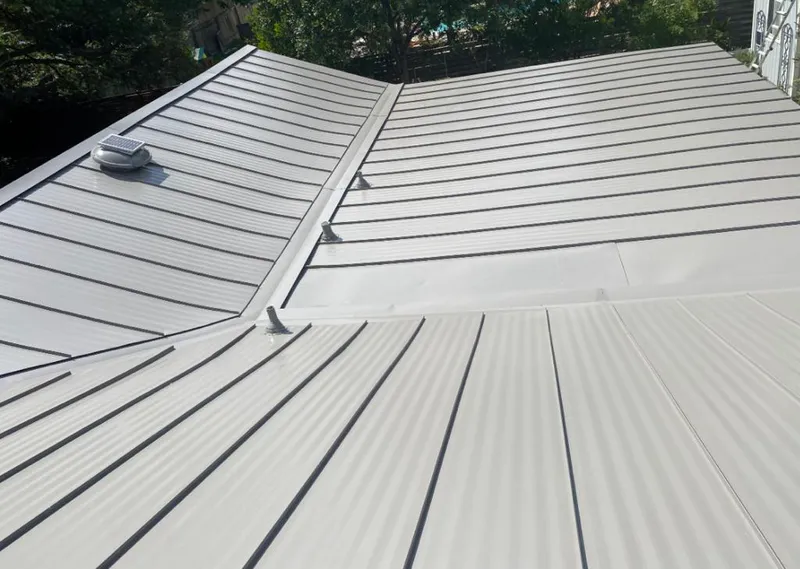 Solar attic fan installed on a metal roof for Roof Ventilation in Silver Springs